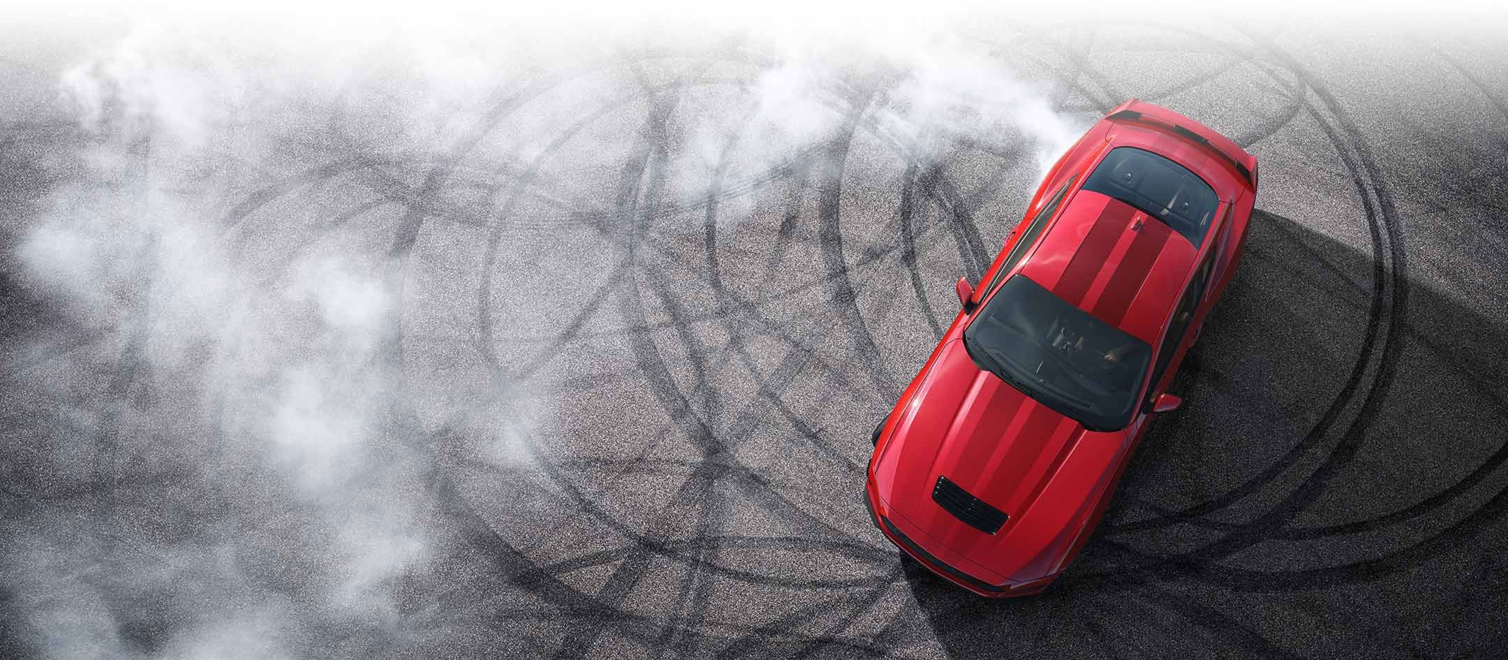 Overhead view of a 2024 Ford Mustang® model with tire tracks on pavement | All Star Ford in Denham Springs LA
